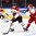 HELSINKI, FINLAND - DECEMBER 28: Canada's Travis Sanheim #23 stickhandles the puck away from Denmark's Jeppe Korsgaard #20 during preliminary round action at the 2016 IIHF World Junior Championship. (Photo by Matt Zambonin/HHOF-IIHF Images)

